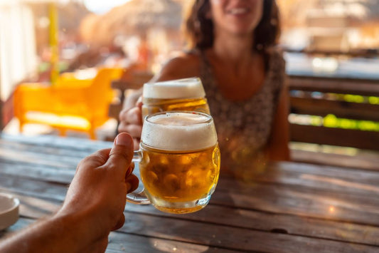 Couple holding a beer mug