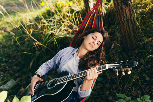 A girl playing guitar