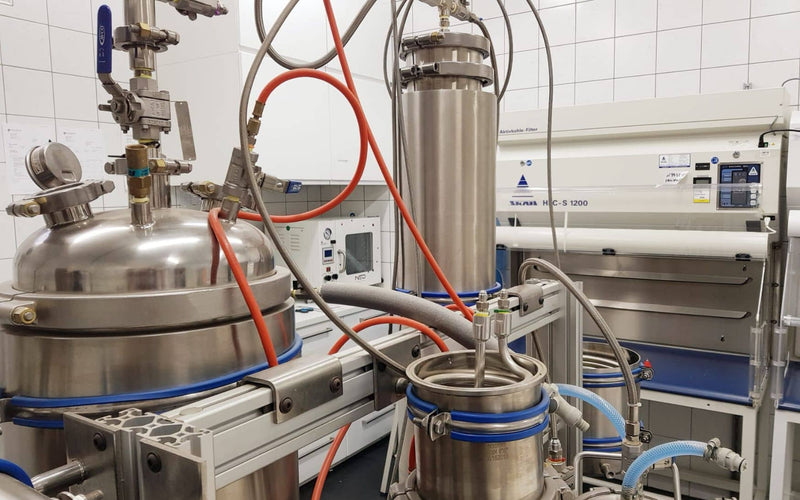 Stainless-steel processing equipment with filtration units in a Formula Swiss laboratory